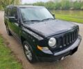 Чорний Джип Patriot, об'ємом двигуна 2.4 л та пробігом 60 тис. км за 11500 $, фото 1 на Automoto.ua