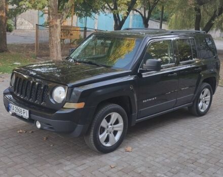 Чорний Джип Patriot, об'ємом двигуна 2.4 л та пробігом 184 тис. км за 10500 $, фото 1 на Automoto.ua