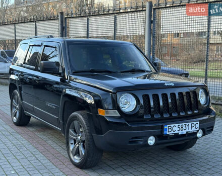 Черный Джип Патриот, объемом двигателя 2.4 л и пробегом 128 тыс. км за 10300 $, фото 1 на Automoto.ua