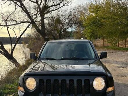 Черный Джип Патриот, объемом двигателя 2.36 л и пробегом 144 тыс. км за 10500 $, фото 1 на Automoto.ua