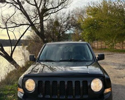 Черный Джип Патриот, объемом двигателя 2.36 л и пробегом 144 тыс. км за 10500 $, фото 1 на Automoto.ua