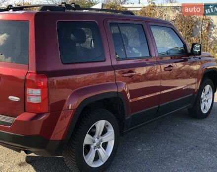 Красный Джип Патриот, объемом двигателя 2.4 л и пробегом 208 тыс. км за 9500 $, фото 1 на Automoto.ua