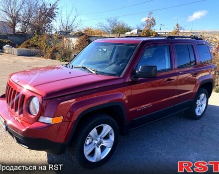 Красный Джип Патриот, объемом двигателя 2.4 л и пробегом 205 тыс. км за 9000 $, фото 1 на Automoto.ua