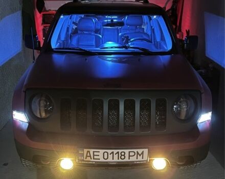 Красный Джип Патриот, объемом двигателя 2.4 л и пробегом 199 тыс. км за 12500 $, фото 1 на Automoto.ua