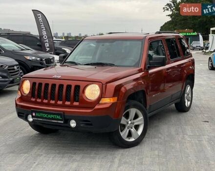 Красный Джип Патриот, объемом двигателя 2.36 л и пробегом 250 тыс. км за 8490 $, фото 1 на Automoto.ua