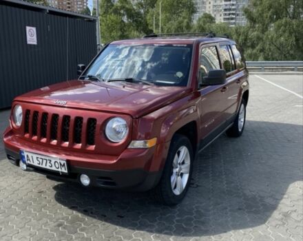 Красный Джип Патриот, объемом двигателя 2.4 л и пробегом 200 тыс. км за 8500 $, фото 1 на Automoto.ua