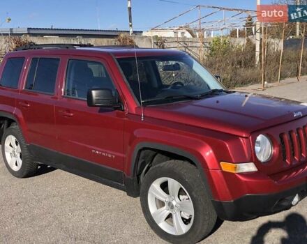 Красный Джип Патриот, объемом двигателя 2.4 л и пробегом 208 тыс. км за 9500 $, фото 1 на Automoto.ua