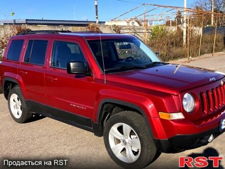 Красный Джип Патриот, объемом двигателя 2.4 л и пробегом 205 тыс. км за 9000 $, фото 1 на Automoto.ua