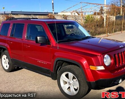 Красный Джип Патриот, объемом двигателя 2.4 л и пробегом 205 тыс. км за 9000 $, фото 1 на Automoto.ua