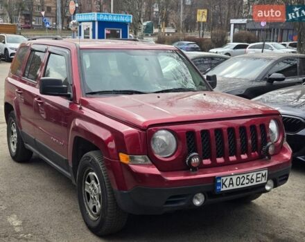 Красный Джип Патриот, объемом двигателя 2.4 л и пробегом 256 тыс. км за 8500 $, фото 1 на Automoto.ua