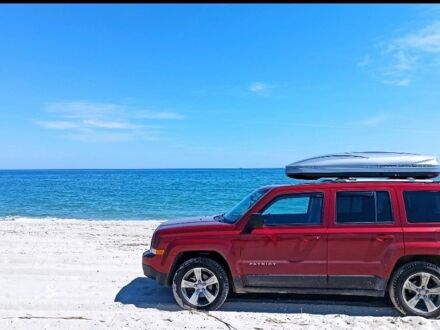 Красный Джип Патриот, объемом двигателя 2.4 л и пробегом 660 тыс. км за 13500 $, фото 1 на Automoto.ua