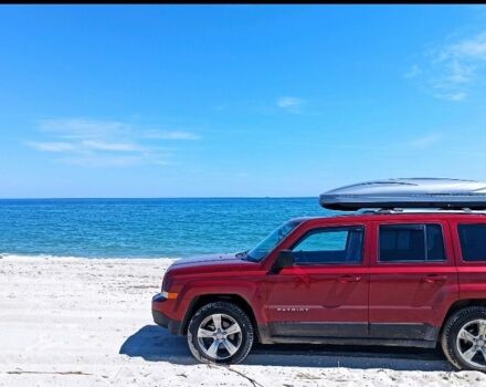 Красный Джип Патриот, объемом двигателя 2.4 л и пробегом 660 тыс. км за 13500 $, фото 1 на Automoto.ua