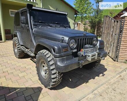 Чорний Джип Wrangler, об'ємом двигуна 3.96 л та пробігом 227 тис. км за 15000 $, фото 10 на Automoto.ua