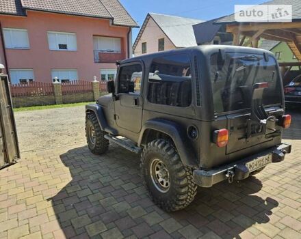 Чорний Джип Wrangler, об'ємом двигуна 3.96 л та пробігом 227 тис. км за 15000 $, фото 6 на Automoto.ua