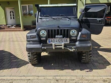 Джип Wrangler 1996 у Тячеве на Automoto.ua Чорний Джип Wrangler, об'ємом двигуна 3.96 л та пробігом 227 тис. км за 11000 $, фото 1 на Automoto.ua