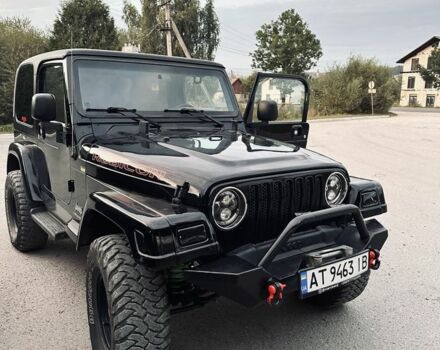 Чорний Джип Wrangler, об'ємом двигуна 4 л та пробігом 118 тис. км за 18900 $, фото 1 на Automoto.ua
