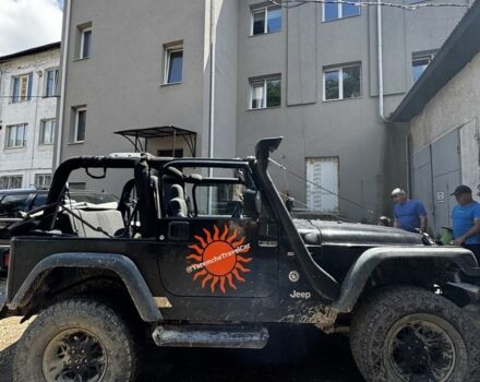Чорний Джип Wrangler, об'ємом двигуна 4 л та пробігом 200 тис. км за 9200 $, фото 1 на Automoto.ua