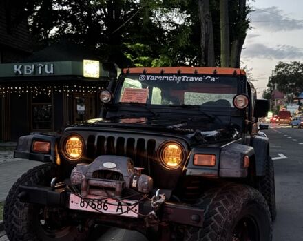 Черный Джип Вранглер, объемом двигателя 4 л и пробегом 200 тыс. км за 9800 $, фото 1 на Automoto.ua