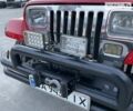 Червоний Джип Wrangler, об'ємом двигуна 4.2 л та пробігом 135 тис. км за 10950 $, фото 11 на Automoto.ua