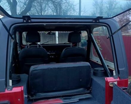 Красный Джип Вранглер, объемом двигателя 4 л и пробегом 200 тыс. км за 14500 $, фото 7 на Automoto.ua