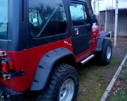 Красный Джип Вранглер, объемом двигателя 4 л и пробегом 200 тыс. км за 14500 $, фото 9 на Automoto.ua