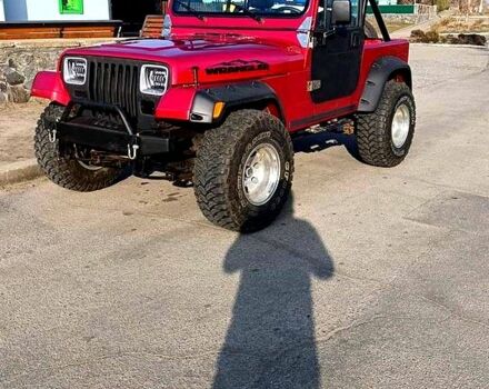 Красный Джип Вранглер, объемом двигателя 4 л и пробегом 200 тыс. км за 14500 $, фото 1 на Automoto.ua