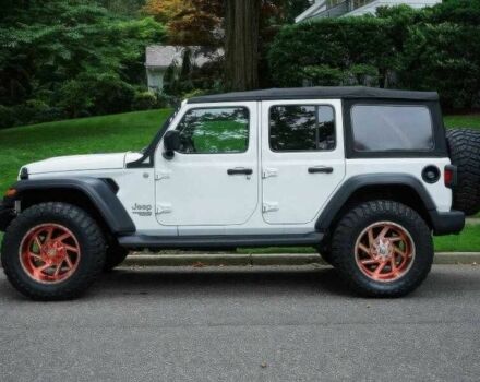 Красный Джип Вранглер, объемом двигателя 2 л и пробегом 57 тыс. км за 11000 $, фото 2 на Automoto.ua