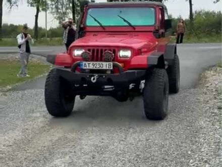 Червоний Джип Wrangler, об'ємом двигуна 4 л та пробігом 100 тис. км за 16499 $, фото 1 на Automoto.ua