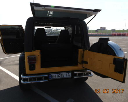 Желтый Джип Вранглер, объемом двигателя 2.5 л и пробегом 180 тыс. км за 14800 $, фото 24 на Automoto.ua