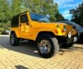 Желтый Джип Вранглер, объемом двигателя 2.5 л и пробегом 151 тыс. км за 16000 $, фото 1 на Automoto.ua