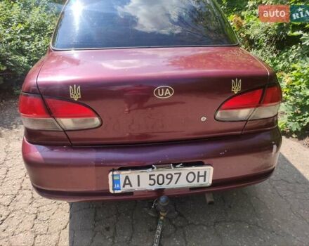 Красный Киа Авелла, объемом двигателя 1.5 л и пробегом 186 тыс. км за 1699 $, фото 8 на Automoto.ua