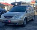 Бежевый Киа Каренс, объемом двигателя 1.8 л и пробегом 281 тыс. км за 4140 $, фото 1 на Automoto.ua