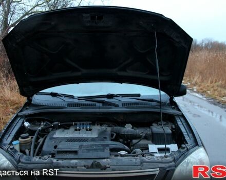 Черный Киа Каренс, объемом двигателя 1.8 л и пробегом 1 тыс. км за 4555 $, фото 12 на Automoto.ua