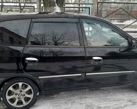 Черный Киа Каренс, объемом двигателя 2 л и пробегом 330 тыс. км за 4500 $, фото 2 на Automoto.ua