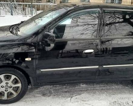 Черный Киа Каренс, объемом двигателя 2 л и пробегом 330 тыс. км за 4500 $, фото 1 на Automoto.ua