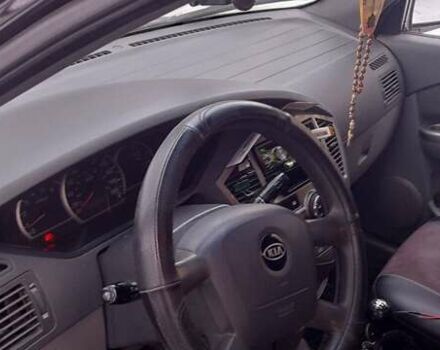 Черный Киа Каренс, объемом двигателя 2 л и пробегом 330 тыс. км за 4500 $, фото 7 на Automoto.ua