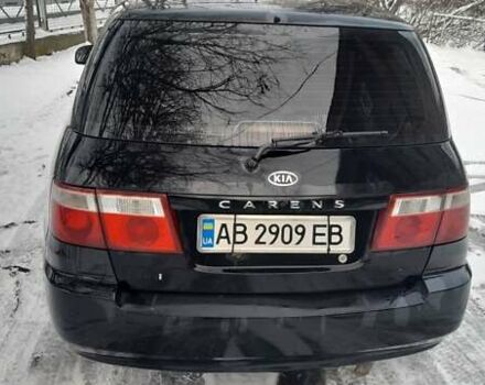 Черный Киа Каренс, объемом двигателя 2 л и пробегом 330 тыс. км за 4500 $, фото 3 на Automoto.ua