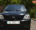 Черный Киа Каренс, объемом двигателя 2 л и пробегом 180 тыс. км за 3800 $, фото 1 на Automoto.ua