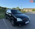 Черный Киа Каренс, объемом двигателя 1.98 л и пробегом 270 тыс. км за 4200 $, фото 1 на Automoto.ua
