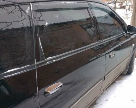 Черный Киа Каренс, объемом двигателя 2 л и пробегом 320 тыс. км за 5830 $, фото 3 на Automoto.ua