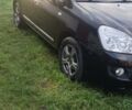 Черный Киа Каренс, объемом двигателя 2 л и пробегом 148 тыс. км за 5700 $, фото 1 на Automoto.ua
