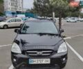 Черный Киа Каренс, объемом двигателя 2 л и пробегом 210 тыс. км за 5800 $, фото 1 на Automoto.ua