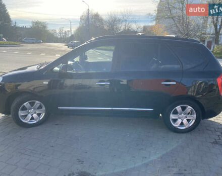 Чорний Кіа Каренс, об'ємом двигуна 2 л та пробігом 229 тис. км за 6900 $, фото 2 на Automoto.ua