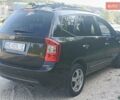 Чорний Кіа Каренс, об'ємом двигуна 2 л та пробігом 265 тис. км за 5800 $, фото 6 на Automoto.ua