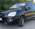 Чорний Кіа Каренс, об'ємом двигуна 2 л та пробігом 265 тис. км за 5800 $, фото 1 на Automoto.ua