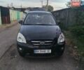 Черный Киа Каренс, объемом двигателя 2 л и пробегом 210 тыс. км за 5800 $, фото 1 на Automoto.ua