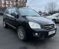Черный Киа Каренс, объемом двигателя 2 л и пробегом 250 тыс. км за 5600 $, фото 1 на Automoto.ua
