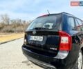 Черный Киа Каренс, объемом двигателя 1.99 л и пробегом 238 тыс. км за 5600 $, фото 2 на Automoto.ua