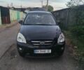 Чорний Кіа Каренс, об'ємом двигуна 2 л та пробігом 210 тис. км за 5800 $, фото 1 на Automoto.ua