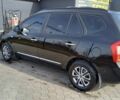 Черный Киа Каренс, объемом двигателя 2 л и пробегом 229 тыс. км за 5200 $, фото 2 на Automoto.ua